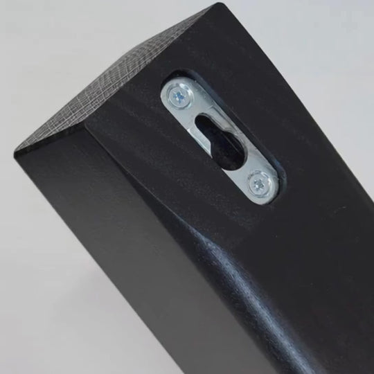 Close-up of keyhole wall-mounting slot on top of the H-Tree for secure attachment to the wall.